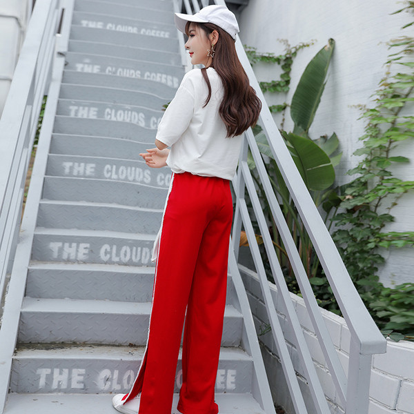 Pantaloni sport de damă în negru și roșu