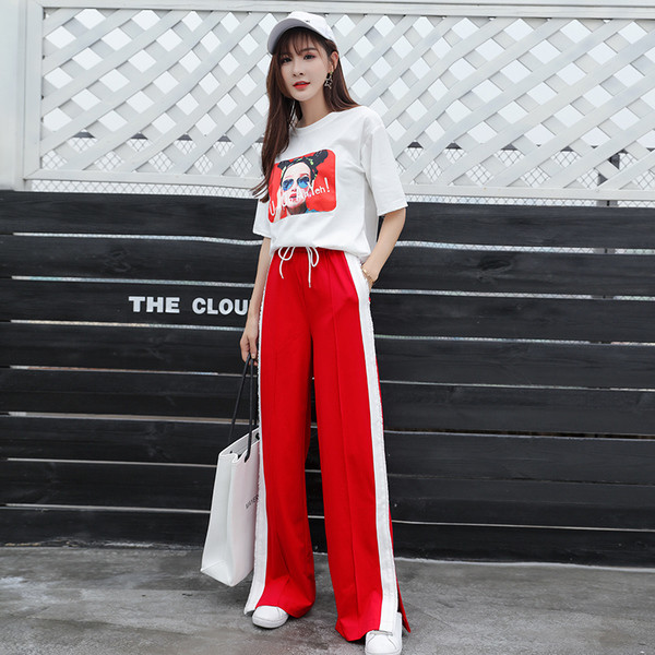 Pantaloni sport de damă în negru și roșu