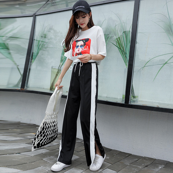 Pantaloni sport de damă în negru și roșu