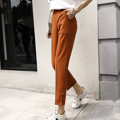 Sportos és elegáns női nadrág fehér, fekete és barna színekben