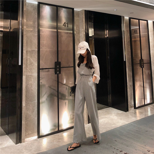 Salopetă casual de damă, cu bretele subțiri și spate gol, în gri și negru