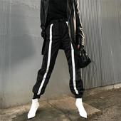 Pantaloni sport de damă în negru cu margini albe