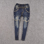 Blugi moderni pentru copii pentru o fată cu perle decorative într-o culoare închisă