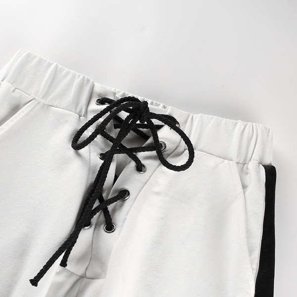 Pantaloni de damă sport-eleganți cu talie înaltă și element-legături