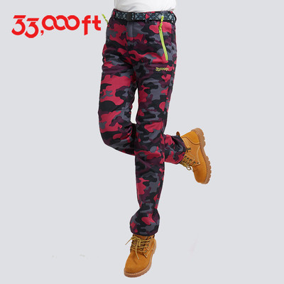 Women`s sports - tourist thick pants in camouflage pattern and clean model