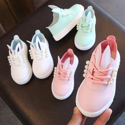 Modern children`s sneakers for a girl with pearls and 3D decoration in three colors