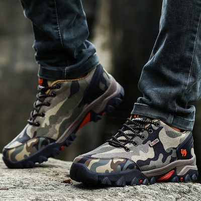 Men`s hiking boots in camouflage pattern