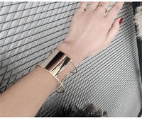 Bratara de dama din metal de culoare auriu si argintiu