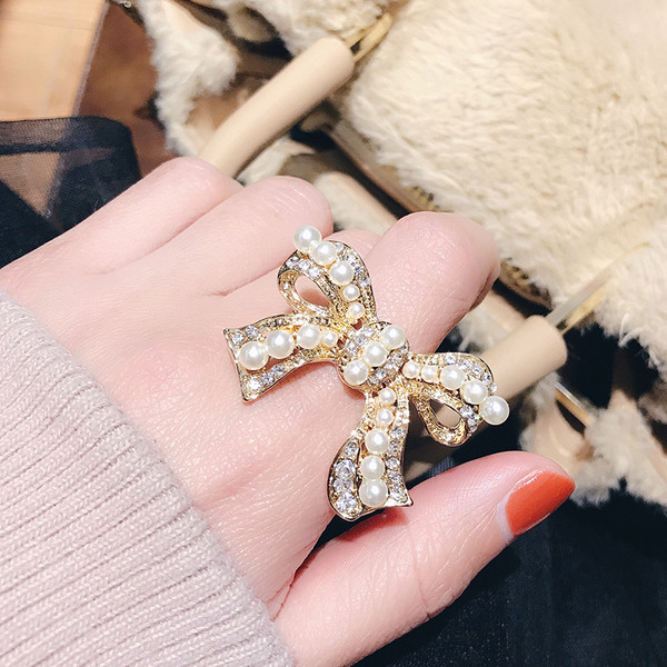 Inel de dama in forma de panglica cu perle - doua culori