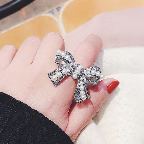 Inel de dama in forma de panglica cu perle - doua culori