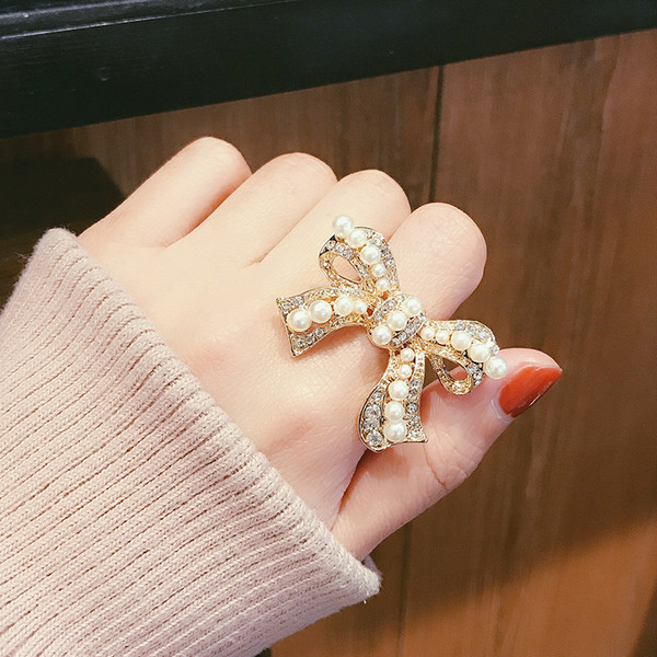 Inel de dama in forma de panglica cu perle - doua culori