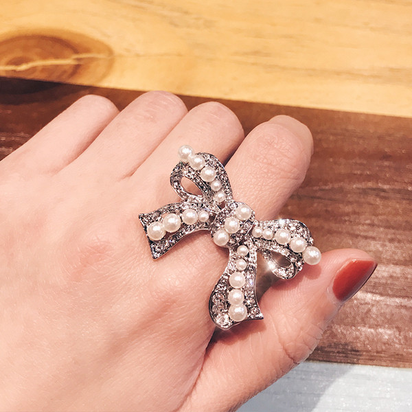 Inel de dama in forma de panglica cu perle - doua culori