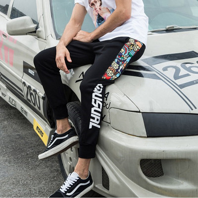 Férfi széles mintás nadrág felirattal és nyomattal több modellben