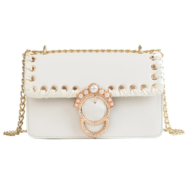 Női táska hosszú fém fogantyúval