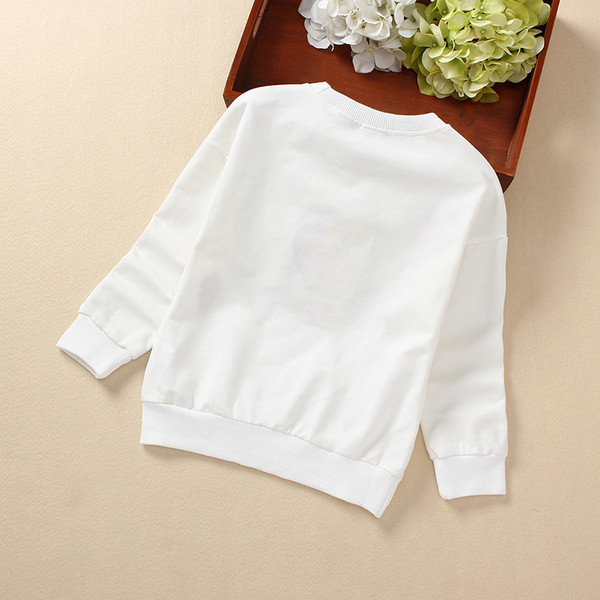 Alkalmi gyerekblúz színes rátéttel, fekete-fehérben