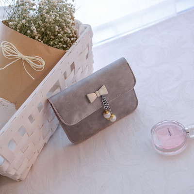 Stílusos női táska hosszú füllel