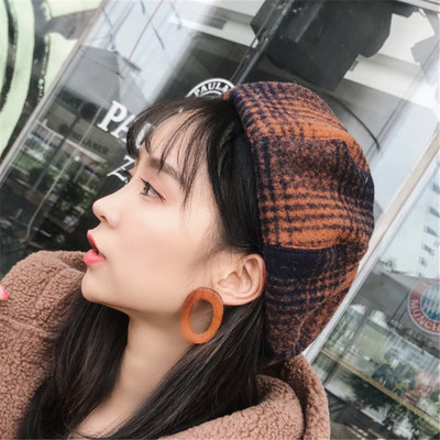 Stylish women`s winter hat in three colors