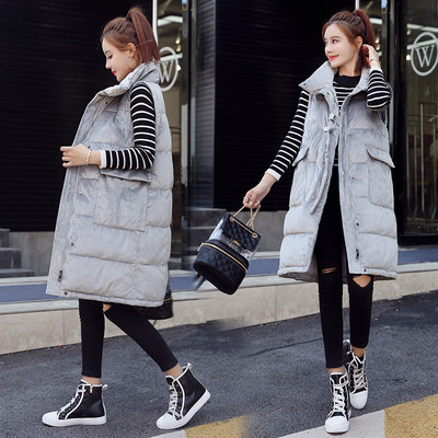 Γυναικείο μακρύ γιλέκο με ψηλή γιακά με τσέπες και μεταλλικό στοιχείο με  κορδόνια