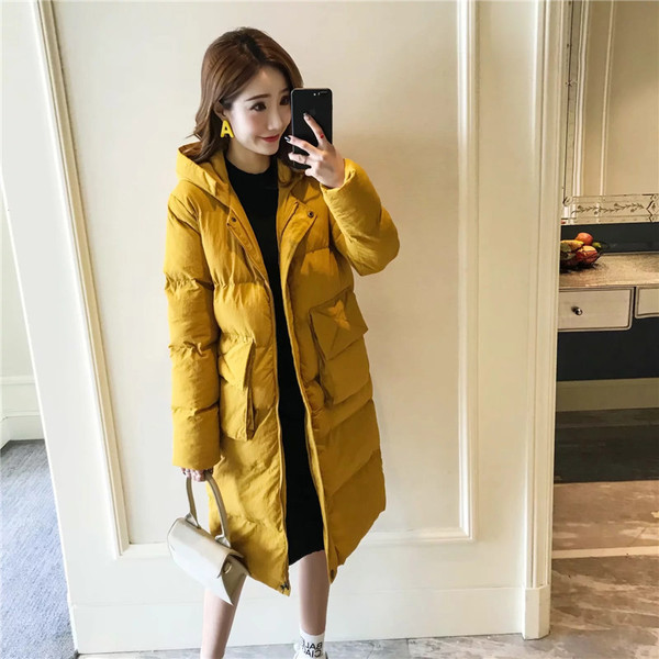 Μακρύ γυναικείο μπουφάν  σε κίτρινο χρώμα