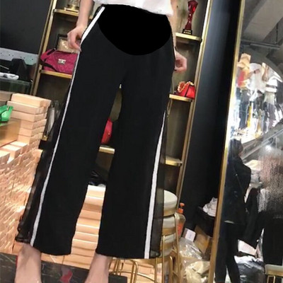 Μοντέρνα παντελόνια για εγκύους με καθαρή και πλευρική άκρη σε μαύρο χρώμα