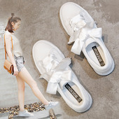 Γυναικεία πάνινα παπούτσια σε ένα πολύχρωμο οτίβο