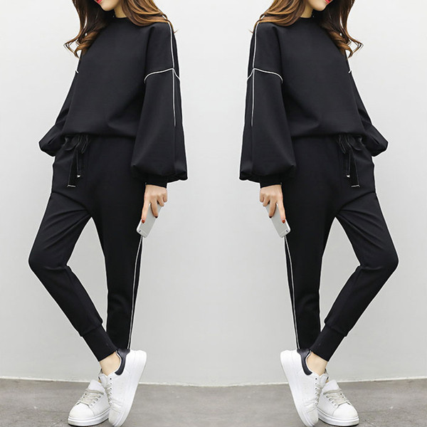 Set sport de damă de culoare neagră în două părți - hanorac cu mâneci largi și trening cu talie elastică