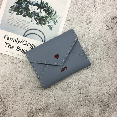 Γυναικείο πορτοφόλι σε διάφορα χρώματα με επιγραφή