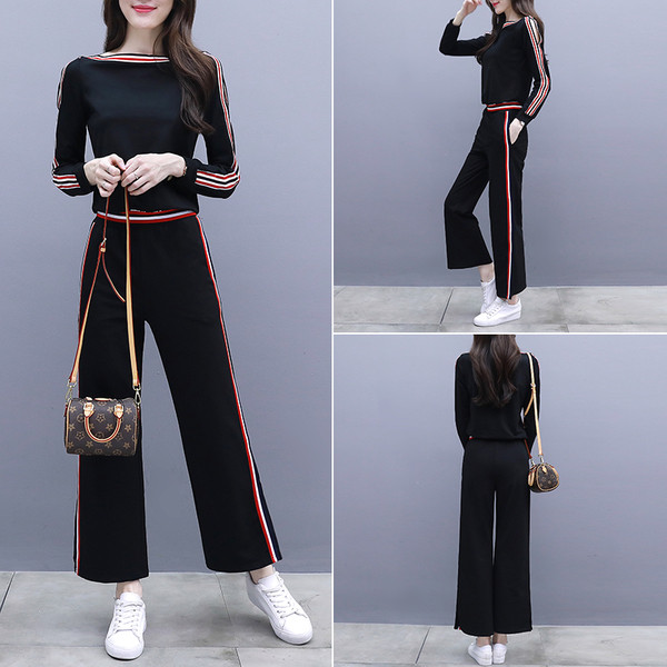 Μοντέρνο γυναικείο αθλητικό σετ με χρωματιστές άκρες και σχισμές σε λευκό και μαύρο χρώμα