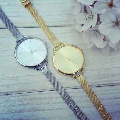 Delicate women`s watch in silver and gold color