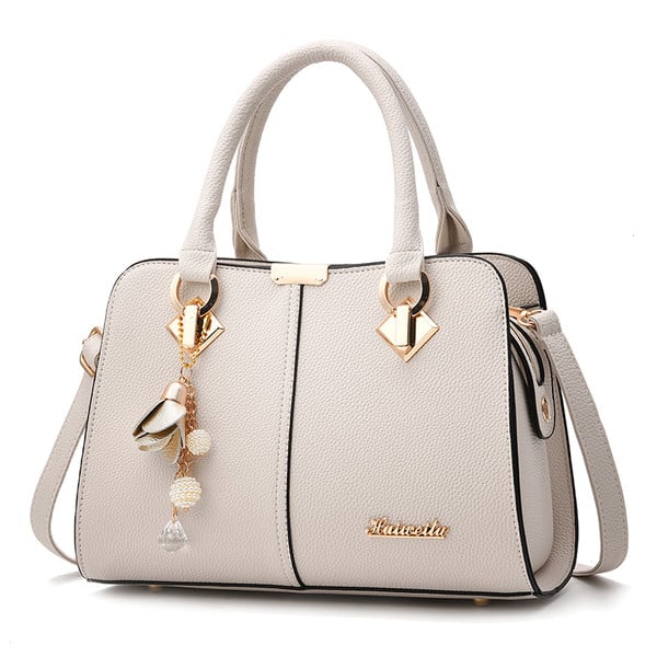 Women`s bag with a metal element in several colors