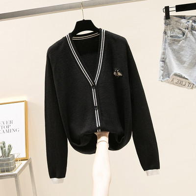 Μοντέρνα γυναικεία ζακέτα με κεντήματα σε λευκό και μαύρο χρώμα