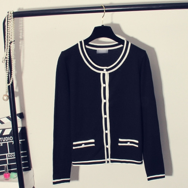 Нов модел дамска жилетка в бял и черен цвят