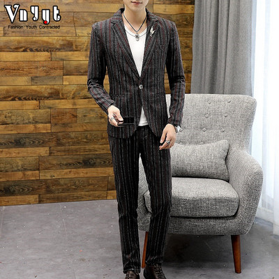 Striped men`s suit in several colors in two parts - jacket and pants