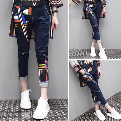 Modern women`s jeans with colorful motifs