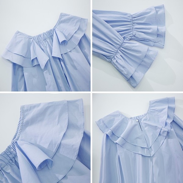 Μοντέρνα γυναικεία μπλούζα με βολάν σε λευκό και μπλε χρώμα