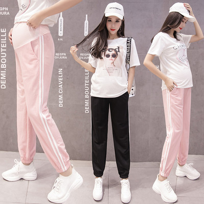 Sports pants for pregnant women with edging in black and pink