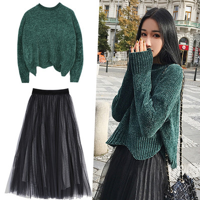 Modern women`s set - sweater wide model and skirt