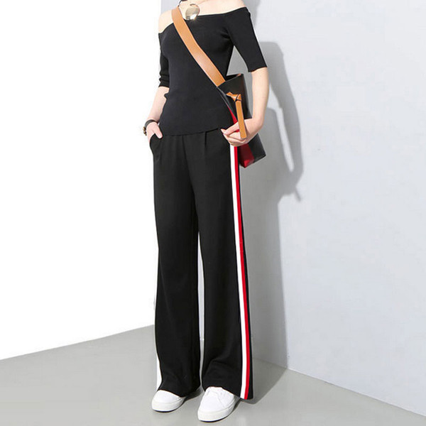 Női alkalmi nadrág fekete színben, oldalpánttal