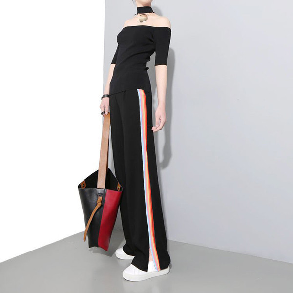 Női alkalmi nadrág fekete színben, oldalpánttal