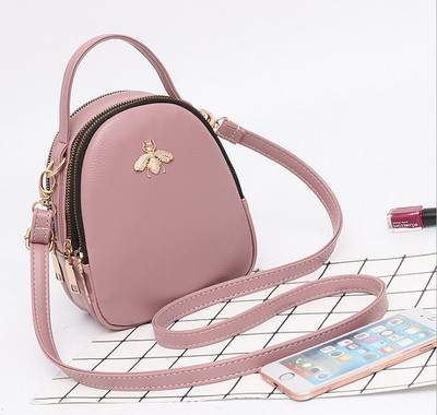 Eko bőrből készült stílusos női táska fém díszítéssel több színben