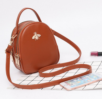 Eko bőrből készült stílusos női táska fém díszítéssel több színben