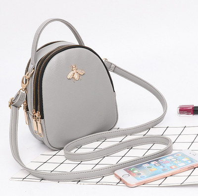 Eko bőrből készült stílusos női táska fém díszítéssel több színben