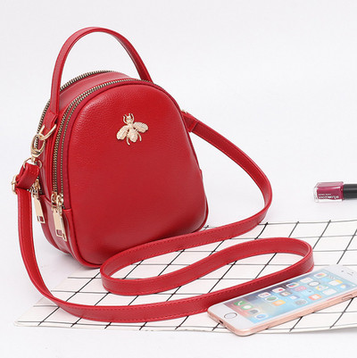 Eko bőrből készült stílusos női táska fém díszítéssel több színben