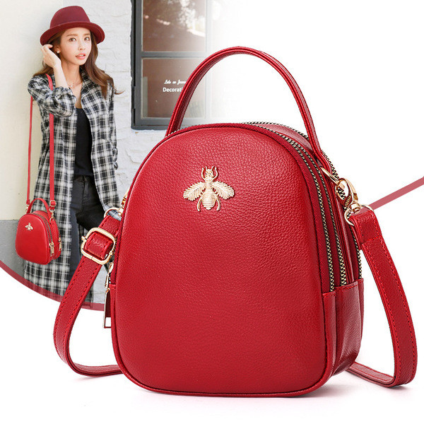 Eko bőrből készült stílusos női táska fém díszítéssel több színben