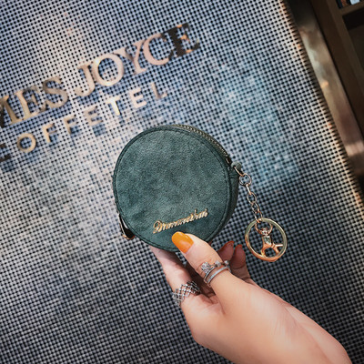 Μοντέρνο γυναικείο πορτοφόλι σε στρογγυλό σχήμα