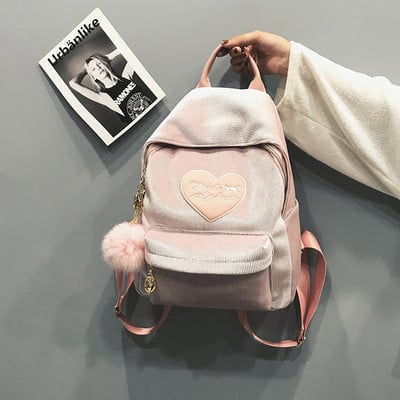 Γυναικείο σακίδιο με αξεσουάρ σε μαύρο και ροζ χρώμα