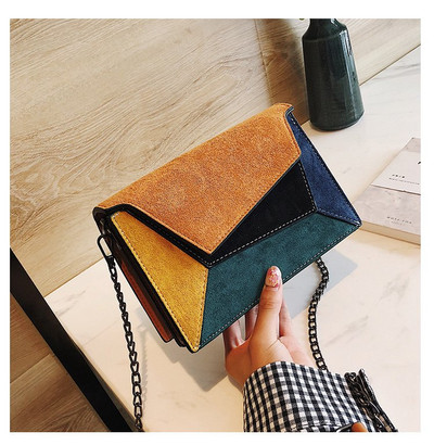 Μοντέρνα γυναικεία τσάντα από οικολογικό σουέτ με μεταλλική λαβή σε διάφορα χρώματα