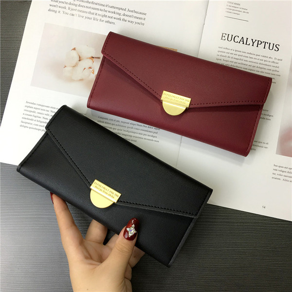 Női pénztárca négy színben fém csattal