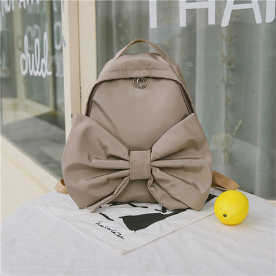 Modern női hátizsák három színben szalaggal