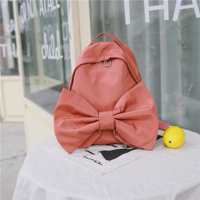 Modern női hátizsák három színben szalaggal